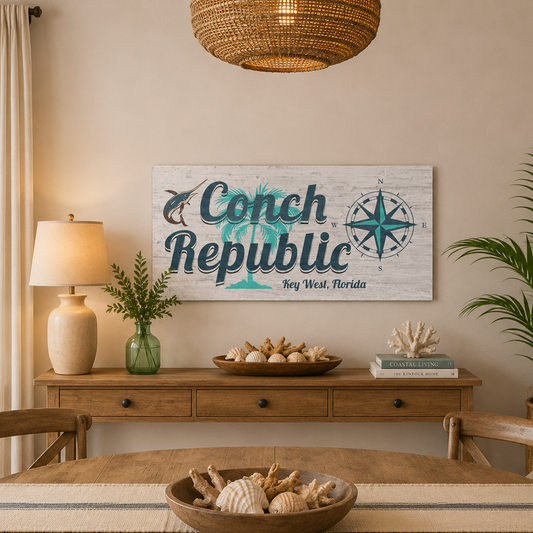 Dining room with a 'Conch Republic' sign on the wall, wooden table, and chairs.