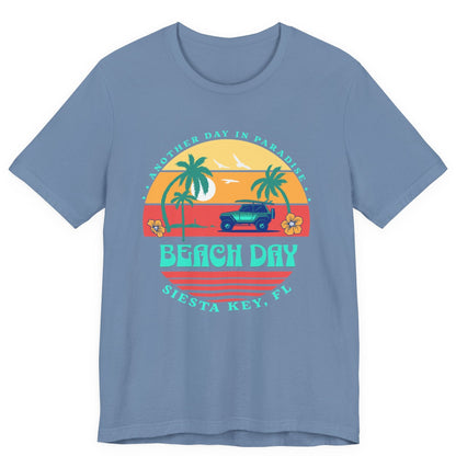 Blue t-shirt with a 'Beach Day' graphic design on a white background by Caribbean Rays