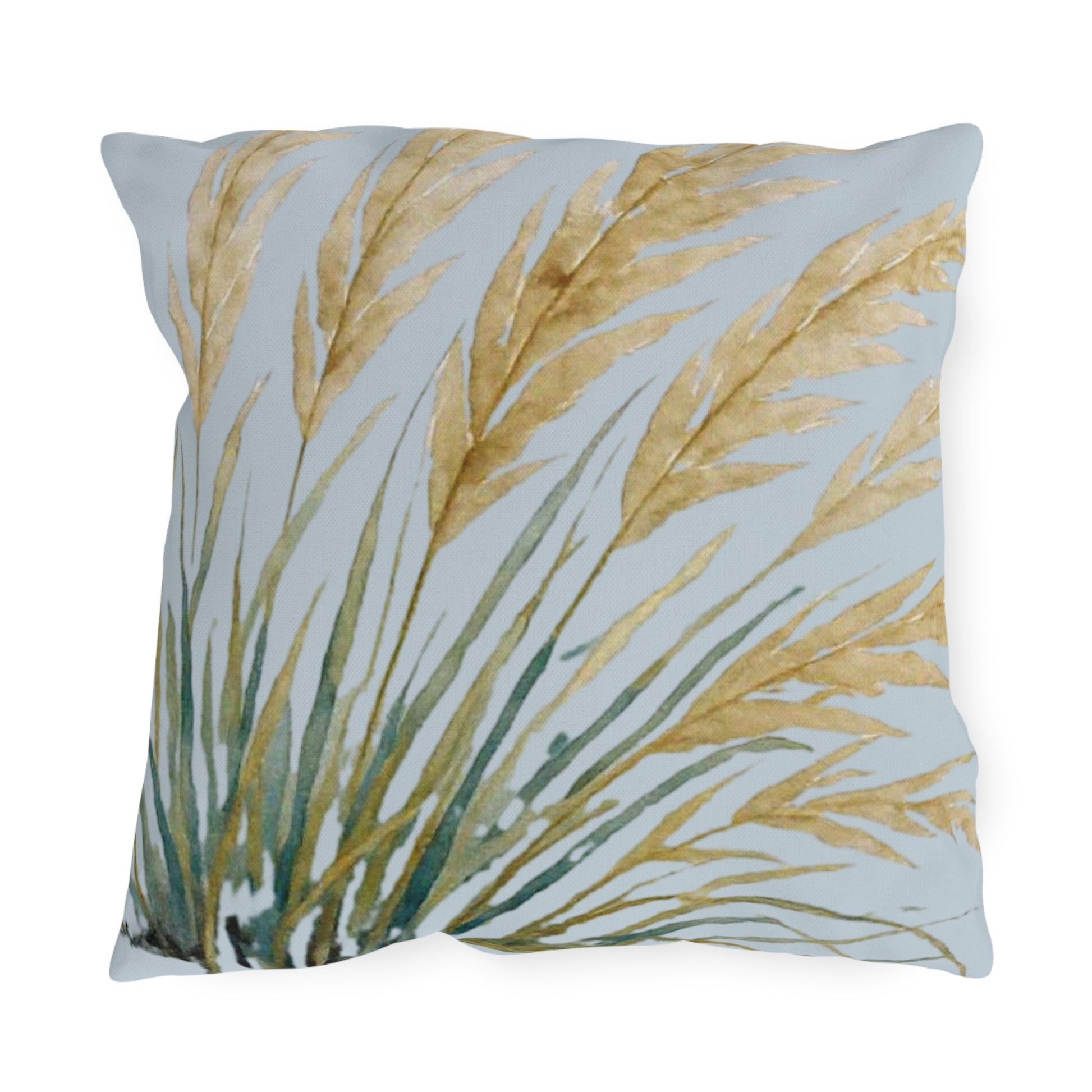Decorative pillow with leaf pattern on a light blue background