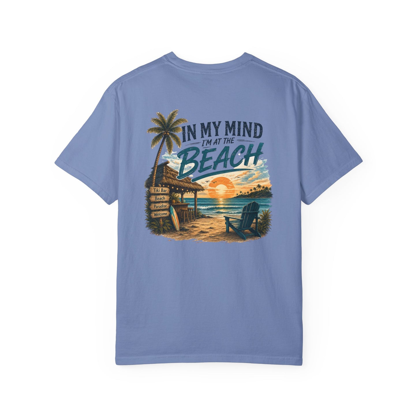 Blue t-shirt with beach graphic and text on a white background