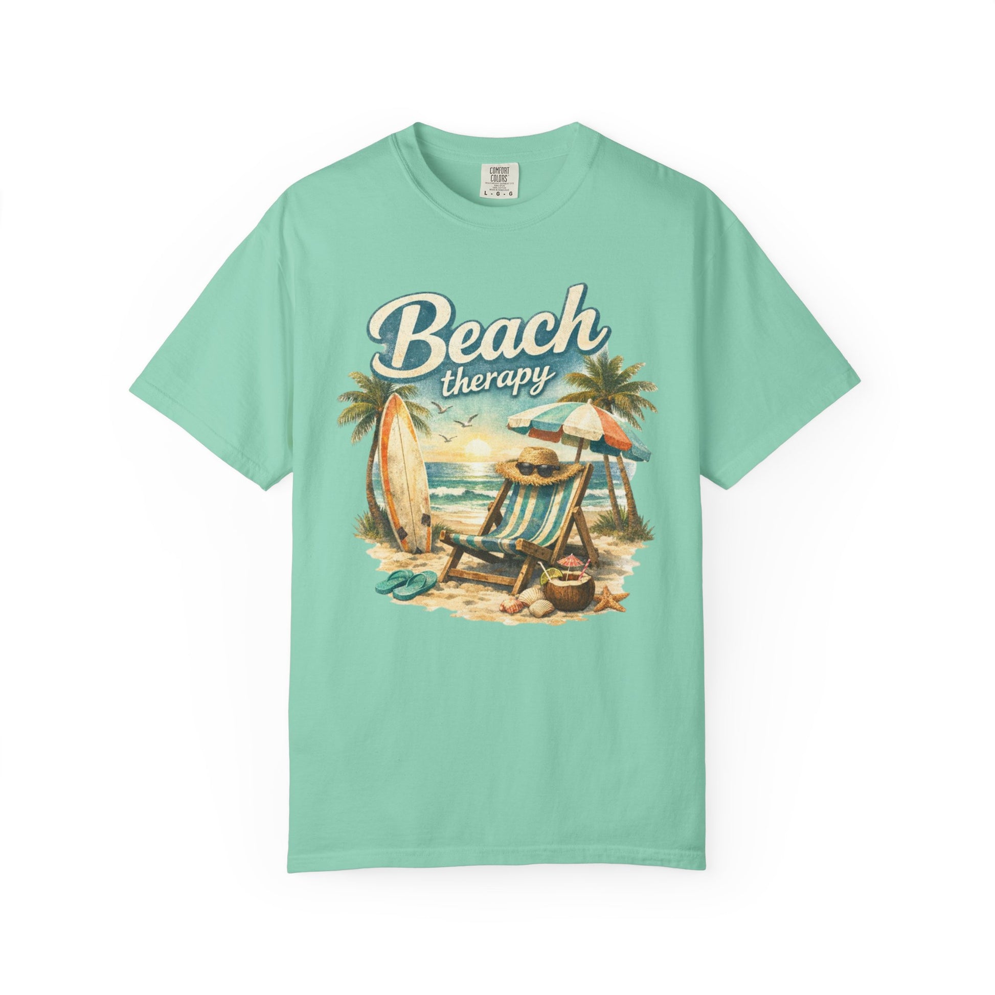Mint green t-shirt with 'Beach Therapy' graphic on a white background