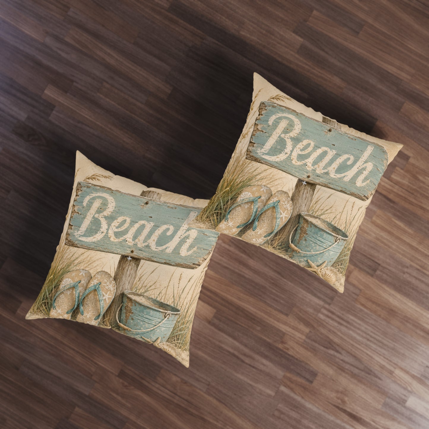 Set of two square beach-themed floor pillows, beige with teal “Beach” print and sandals