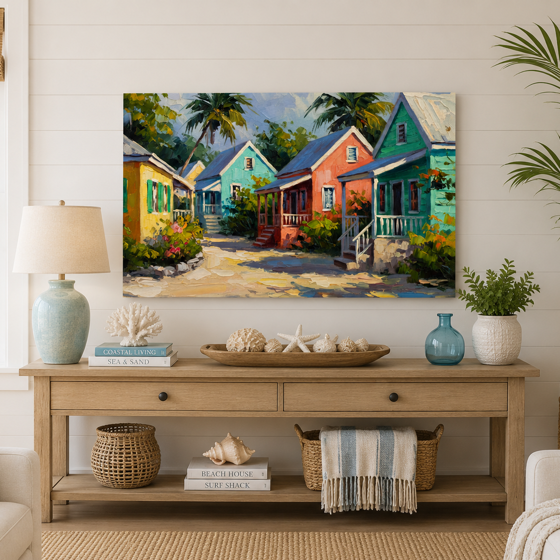 Living room with a coastal painting of colorful houses on the wall above a wooden console table.