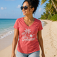 Coral pink women's V-neck tee with Bahamas palm tree graphic print, worn