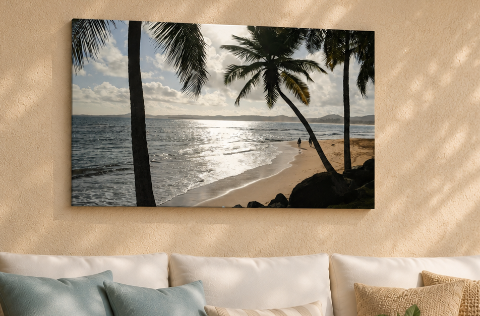 Beach scene with palm trees on a wall above a sofa