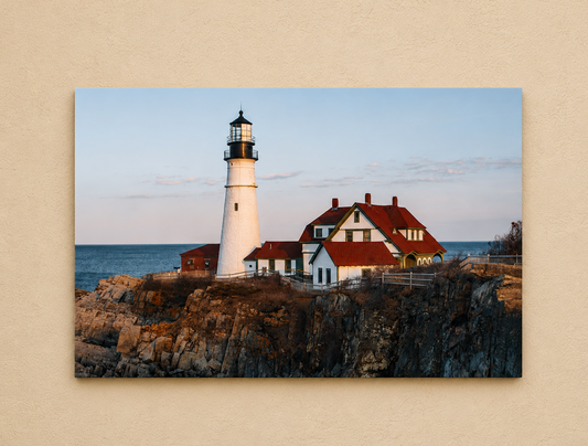 Lighthouse and building on a rocky cliff with ocean view