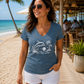 Women’s V-neck tee with dolphin and beach sunset graphic, heather blue