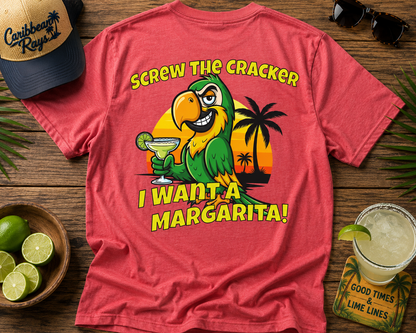 Red t-shirt with a parrot graphic and text on a wooden surface with a hat, limes, and a margarita.