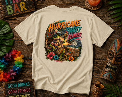 T-shirt with a tropical design and text on a wooden table with tiki-themed decor.