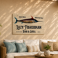 Decorative sign for 'Lazy Fisherman Bar & Grill' above a couch with pillows in an outdoor setting.