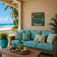 Turquoise outdoor sofa with decorative pillows on a patio with ocean view