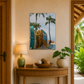 Decorative interior with a wooden console table, lamp, and artwork of surfboards and palm trees.