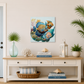 Nautical-themed decor with a painting of fish, books, and plants in a room with a door and plant.