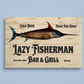 Wooden sign for Lazy Fisherman Bar & Grill with fish illustration on a light blue background