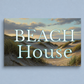 Canvas print with beach scene and 'Beach House' text on a light blue background