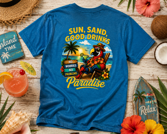 Blue t-shirt with tropical design and text on a wooden surface with beach-themed items.