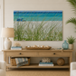 Living room with a beach-themed decor, including a large framed picture of a beach scene.