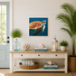 Nautical-themed room with turtle artwork, books, and decor items on a wooden console table.