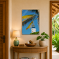 Decorative interior with a table, lamp, and wall art of a lighthouse and palm trees.