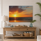 Living room with a large sunset over ocean painting on the wall, wooden console table, and decorative items.