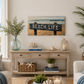 Nautical-themed living room with 'Beach Life' sign, plants, and decor.