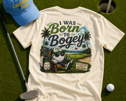 T-shirt with 'I Was Born to Bogey' design, blue cap, golf club, and ball on grass