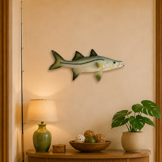 Wooden console table with decorative items against a wall with a fish sculpture.