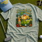 T-shirt with 'Birdied the 19th Hole' design on a golf course, featuring a cap and golf club.