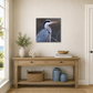 Wooden console table with decorative items against a wall with a heron painting.