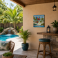 Outdoor patio area with pool, plants, and a 'Pool Rules Have Fun' sign.